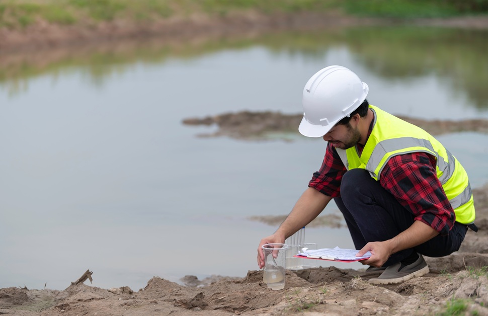 a geo-environmental consultant taking samples for contaminated land risk management